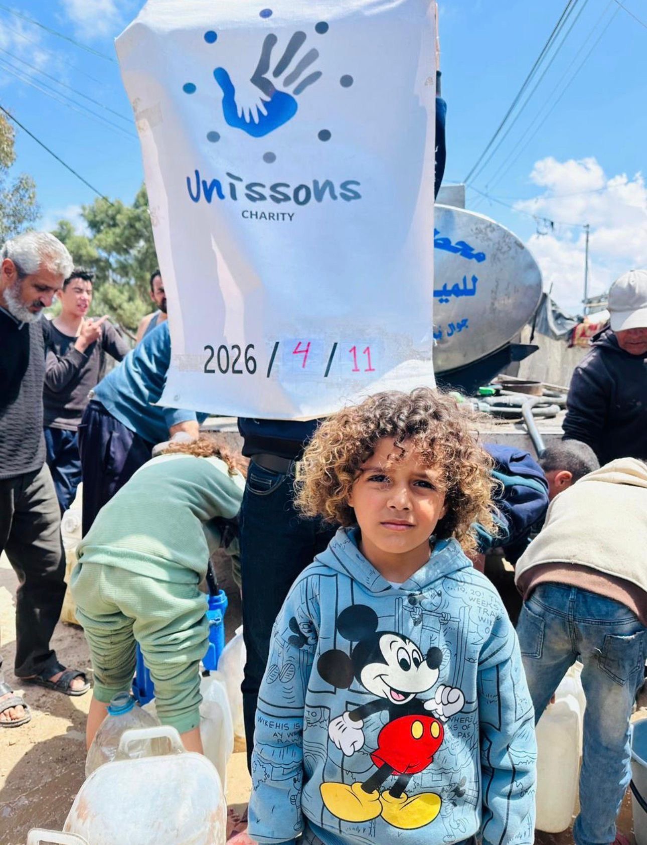Distribution d'eau à Gaza par Unissons